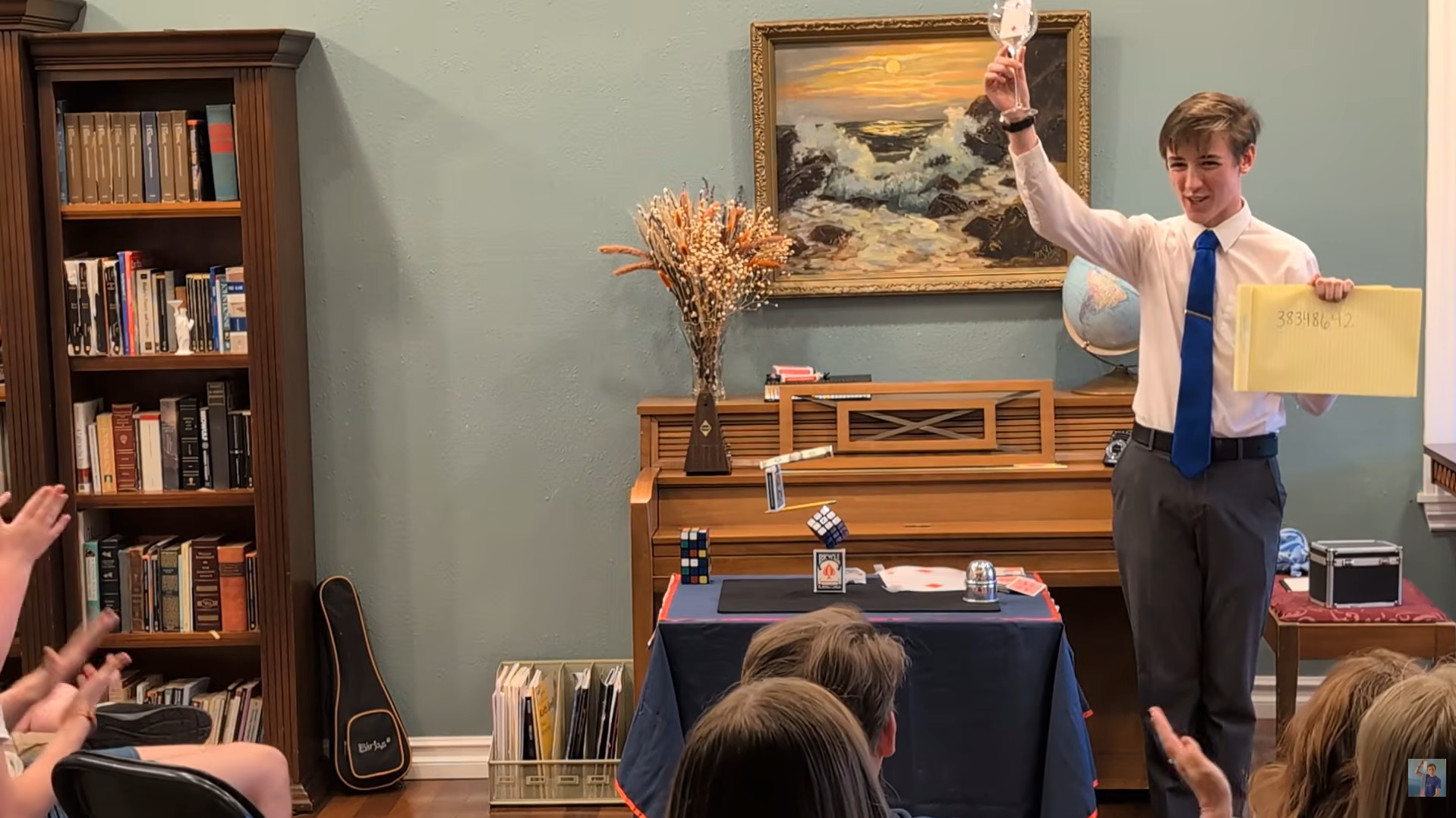 Josiah Guenther performing a stage magic show